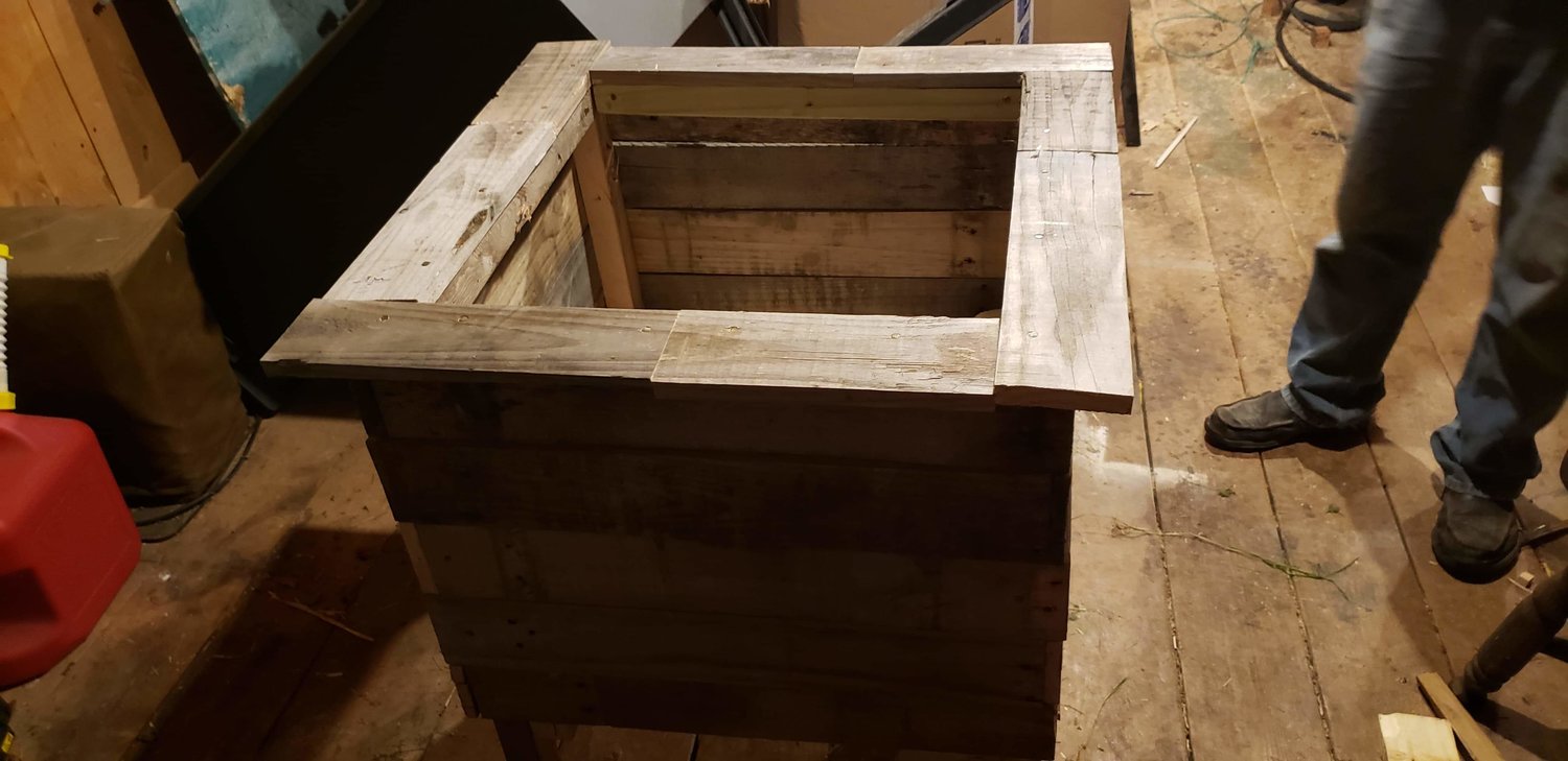 Finished with this wood pallet planter, my appreciative wife’s first question was if I could make a few more.
